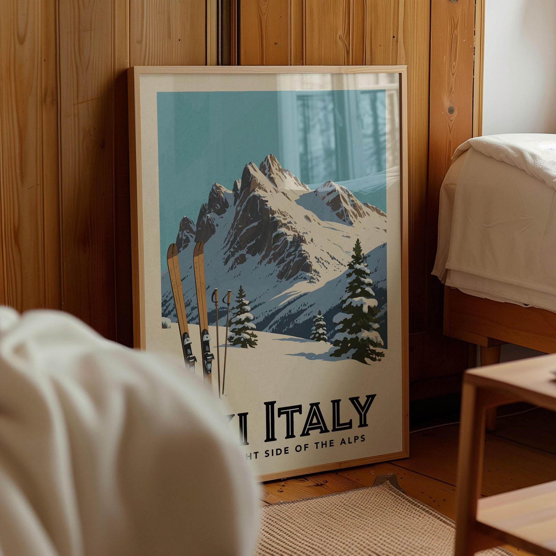 A framed poster of a snowy mountain landscape with ski equipment, depicting the scenic beauty of Italy.