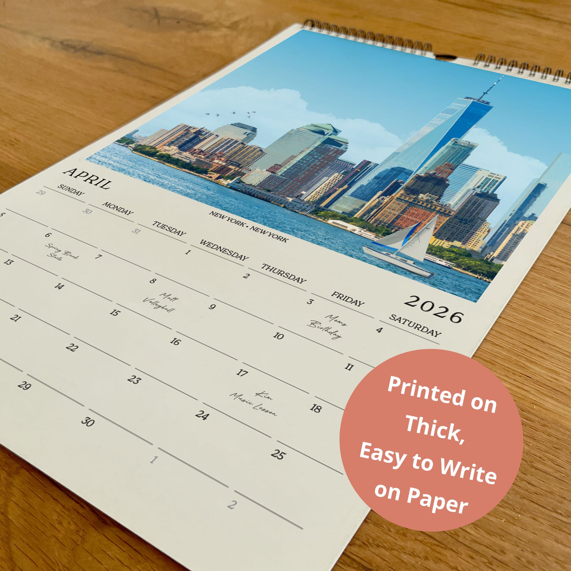 A wall calendar with a cityscape image of New York City on the cover, printed on paper.
