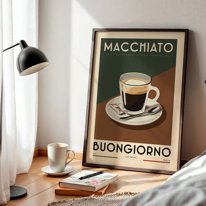 a framed poster of a cup of coffee with the text "MACHIATO" and "BUNGGIORNO" printed on it, along with a cup of coffee and a book on a wooden table.