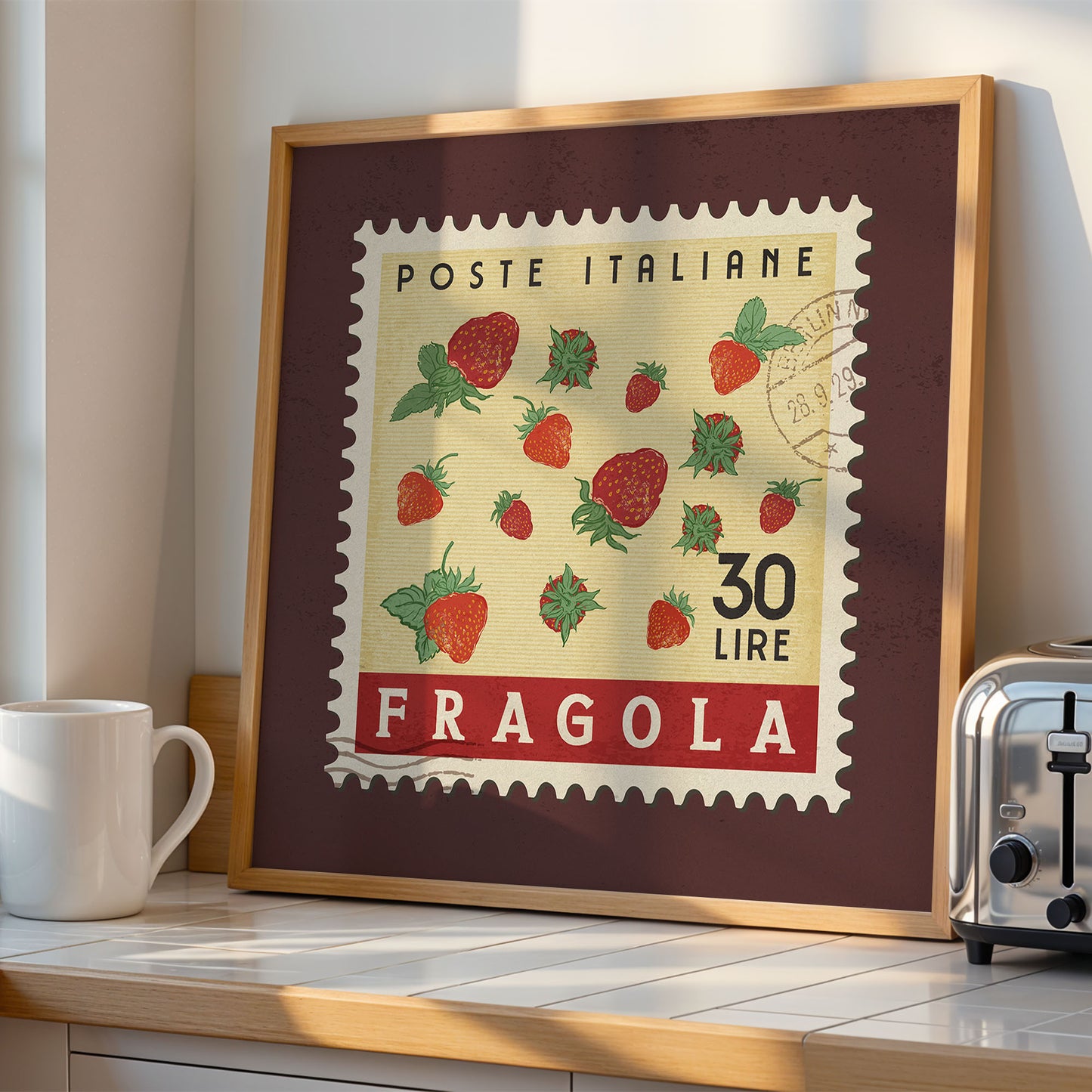 a framed stamp-like artwork depicting a strawberry scene, with the text "POSTE ITALIANE 30 LIRE FRAGOLA" printed on it.