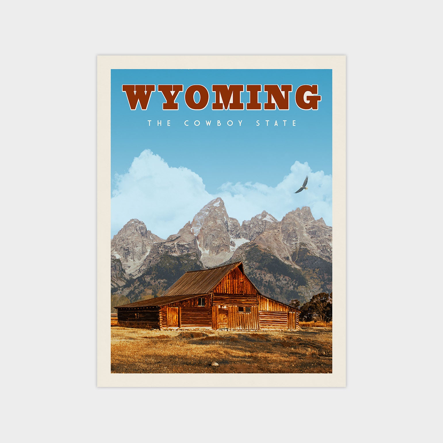 A vintage-style poster of Wyoming, featuring a wooden cabin in the foreground with mountains in the background.
