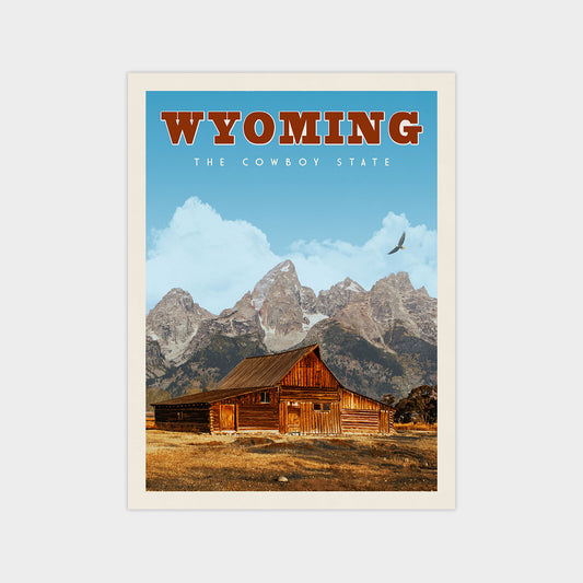 A vintage-style poster of Wyoming, featuring a wooden cabin in the foreground with mountains in the background.