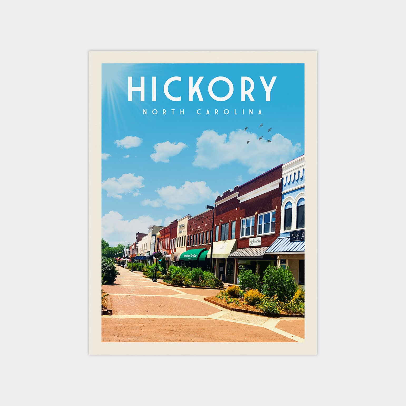 A vintage-style poster depicting a row of colorful brick buildings lining a street in Hickory, North Carolina, with a clear blue sky and birds flying overhead.