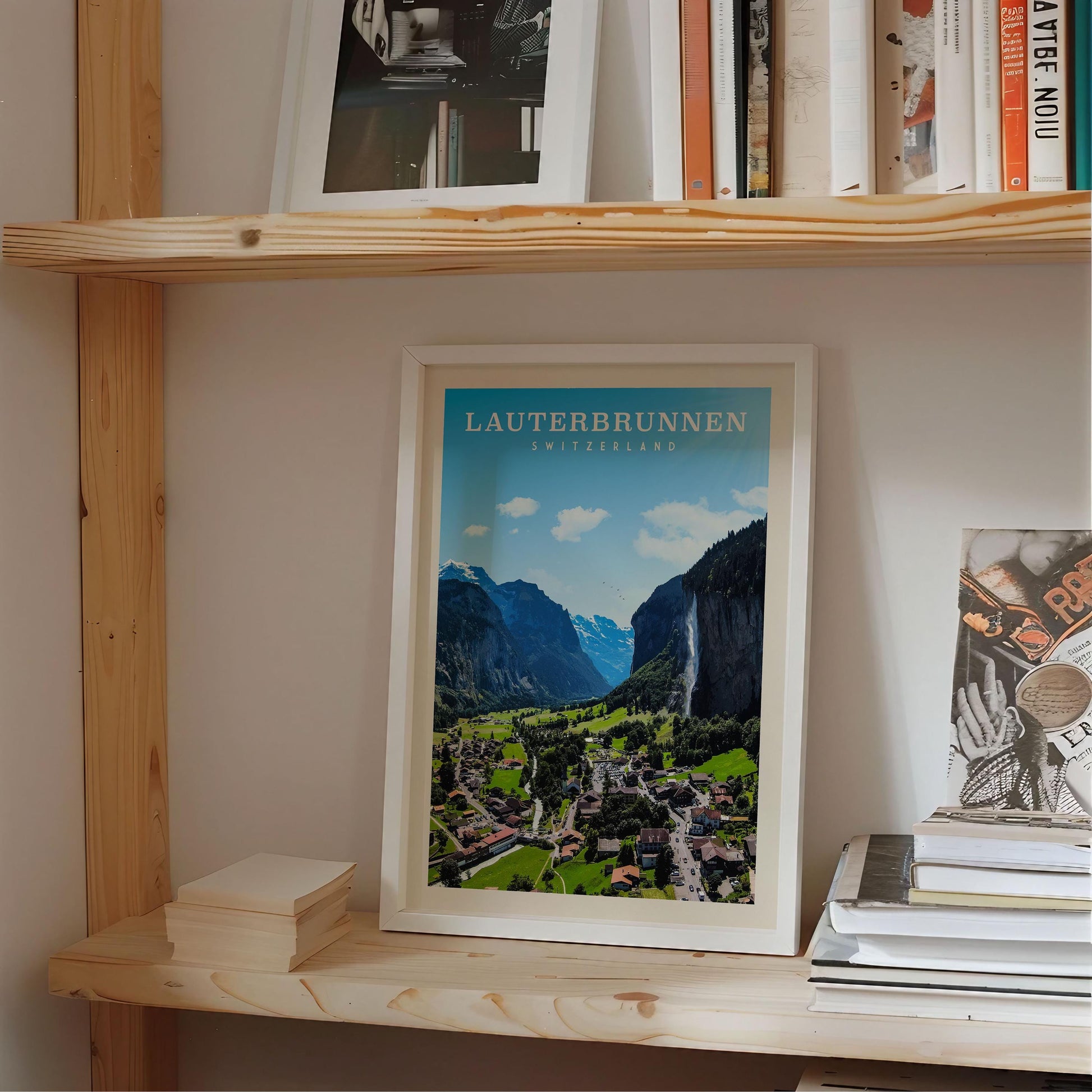 a framed poster of a scenic mountain landscape, with the text "Lauterbrunnen" prominently displayed.