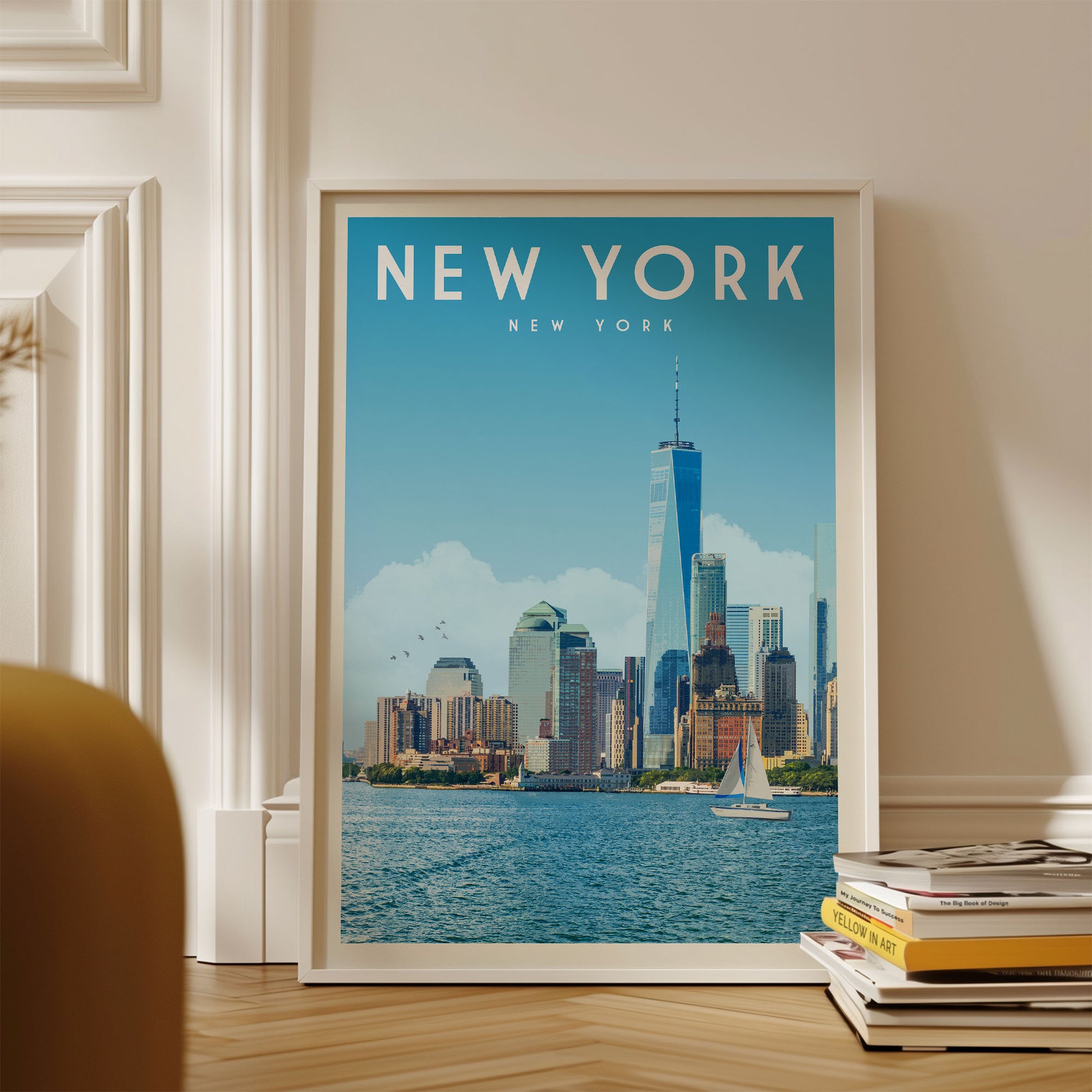 A framed poster of the New York City skyline, featuring the iconic One World Trade Center and other skyscrapers, is displayed on a wall.