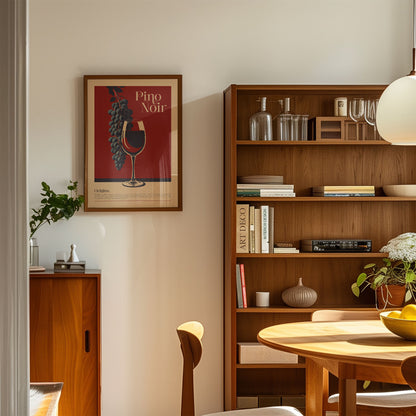 a cozy living room with a wooden bookshelf, a framed poster of a wine glass, and a wooden cabinet. The room has a warm and inviting atmosphere, with natural light streaming in from the window.