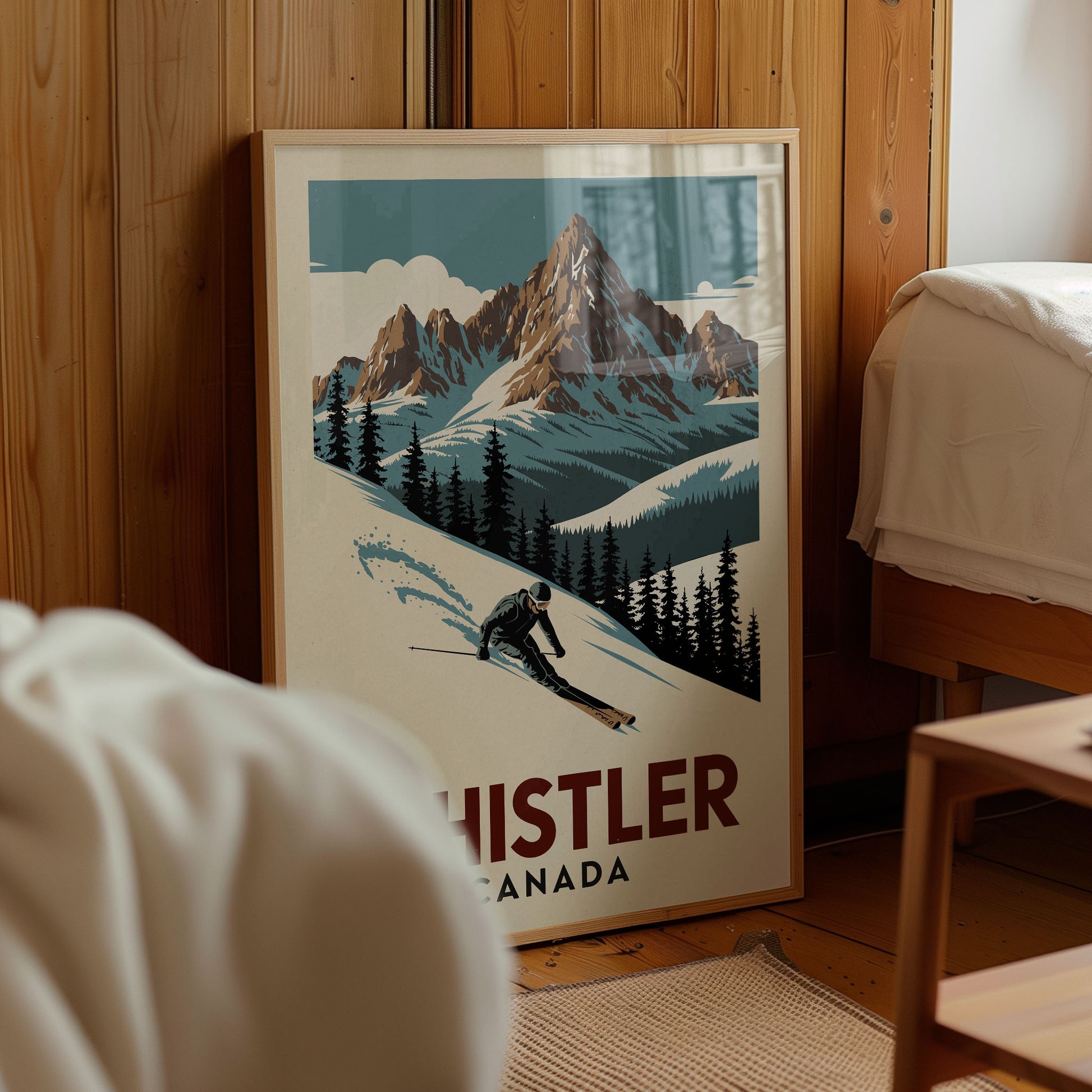 A framed poster of a skier in a snowy mountain landscape, with the text "HISTLER CANADA" prominently displayed.