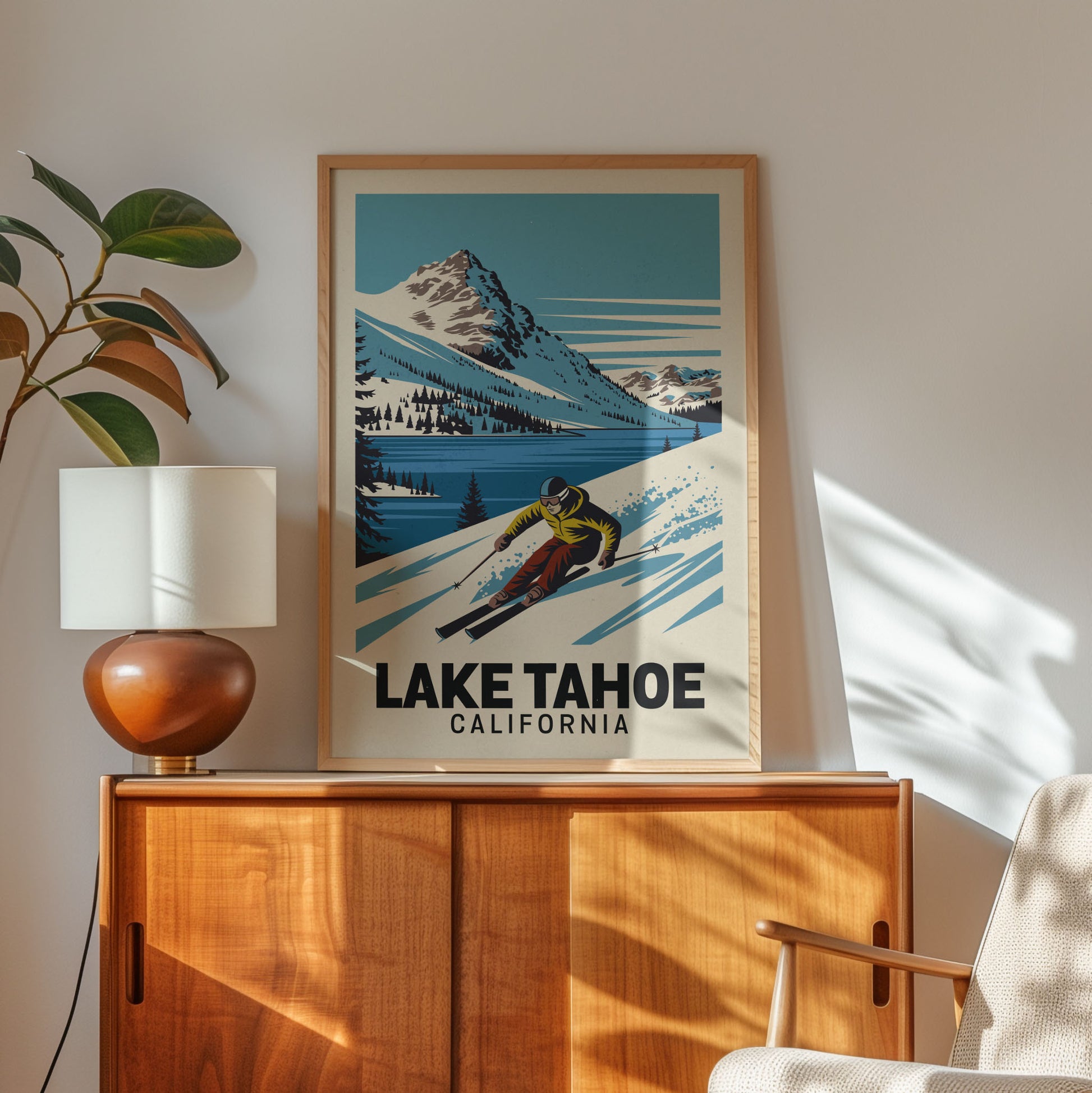 A framed poster of a skier on a snowy mountain, with the text "LAKETAHOE, CALIFORNIA" below the image.