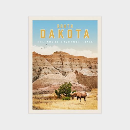 A poster for South Dakota, featuring a scenic landscape with a mountain range, a grazing animal, and a clear blue sky.