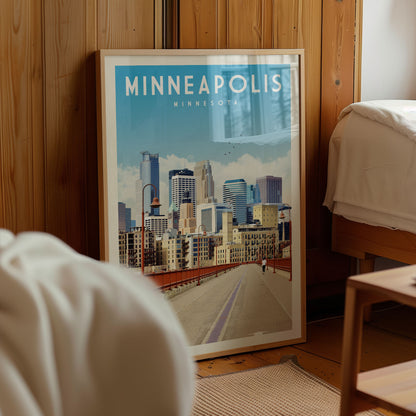 A framed poster of the Minneapolis skyline is displayed in a room with wooden paneling.