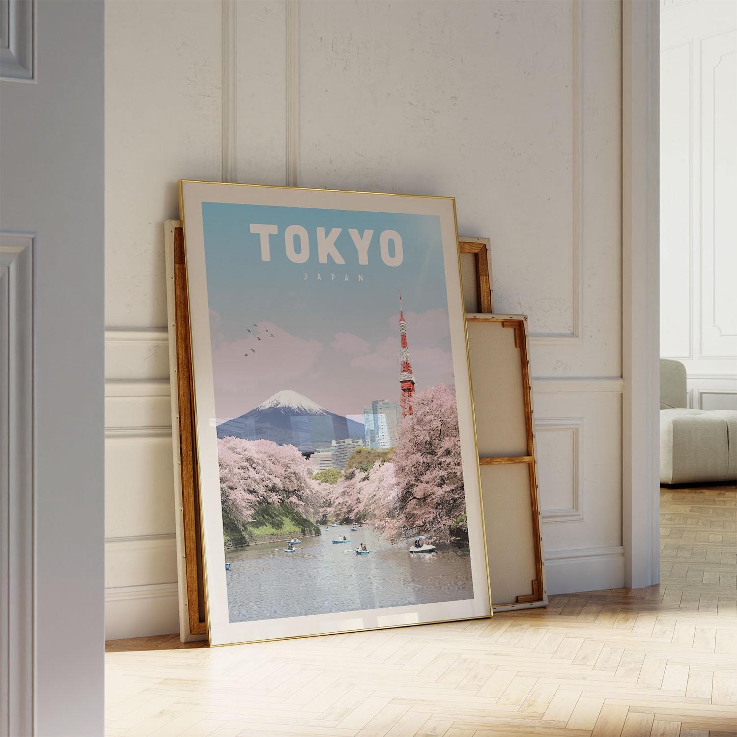 A framed poster of Tokyo, Japan, featuring a scenic view of the city with cherry blossoms and the Tokyo Tower in the background.