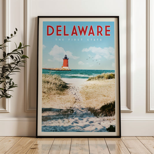 A framed poster of a lighthouse on a beach in Delaware, with the text "Delaware THE FIRST STATE" prominently displayed.