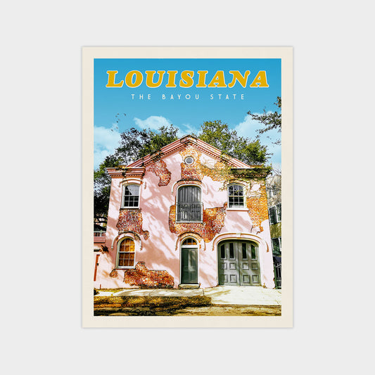 A colorful, vintage-style building with a pink facade and a green door, set against a blue sky with trees in the background.