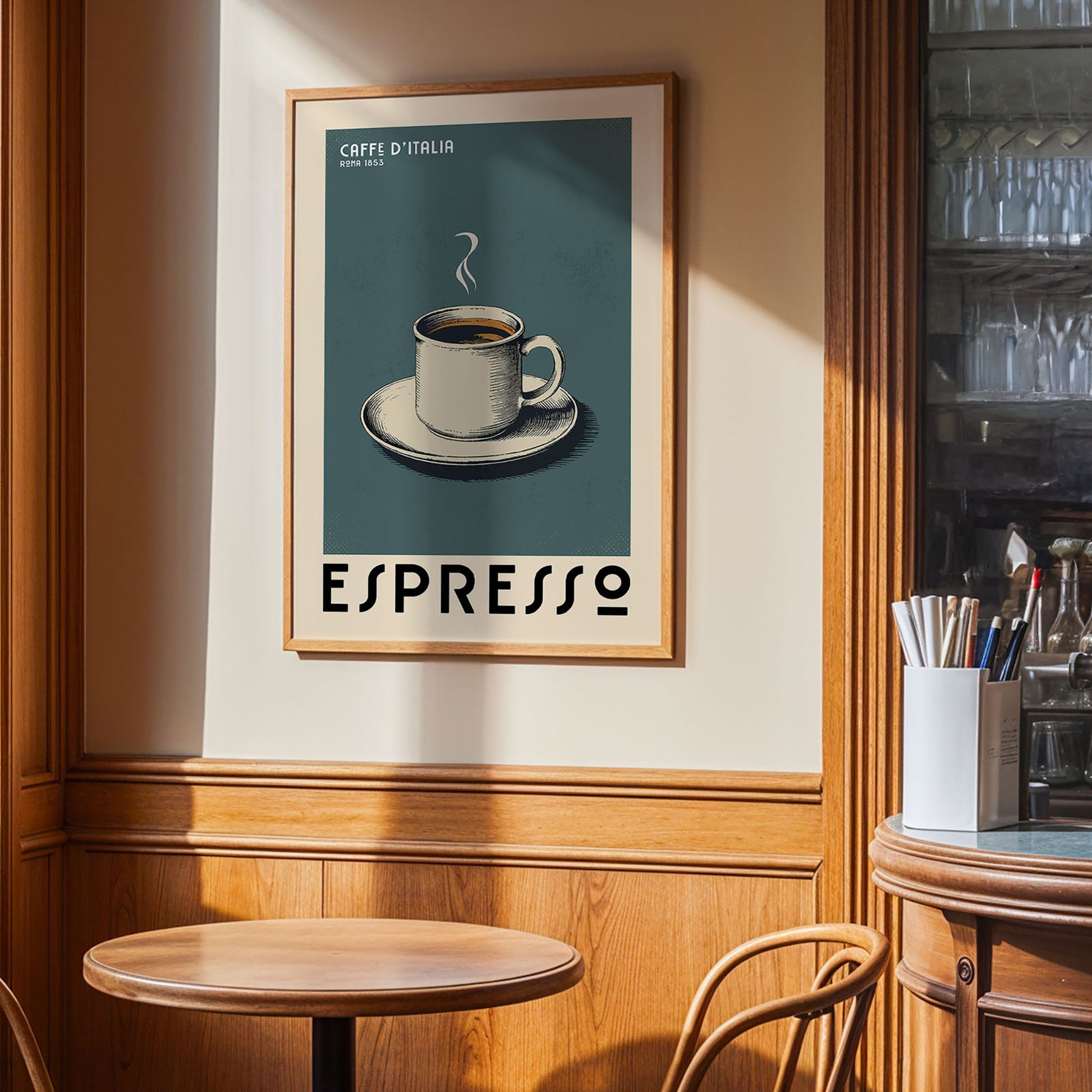 a framed poster of a cup of espresso on a table in a cafe, with a wooden wall and a window in the background.