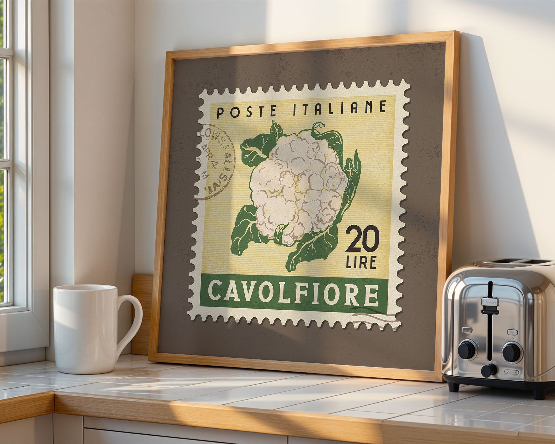 a framed picture of a cauliflower on a kitchen counter