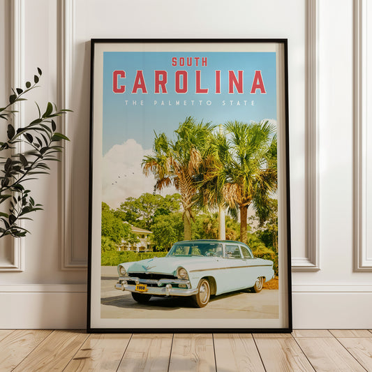 A framed poster of a vintage car parked in front of palm trees, with the text "SOUTH CAROLINA THE PALMETTO STATE" prominently displayed.