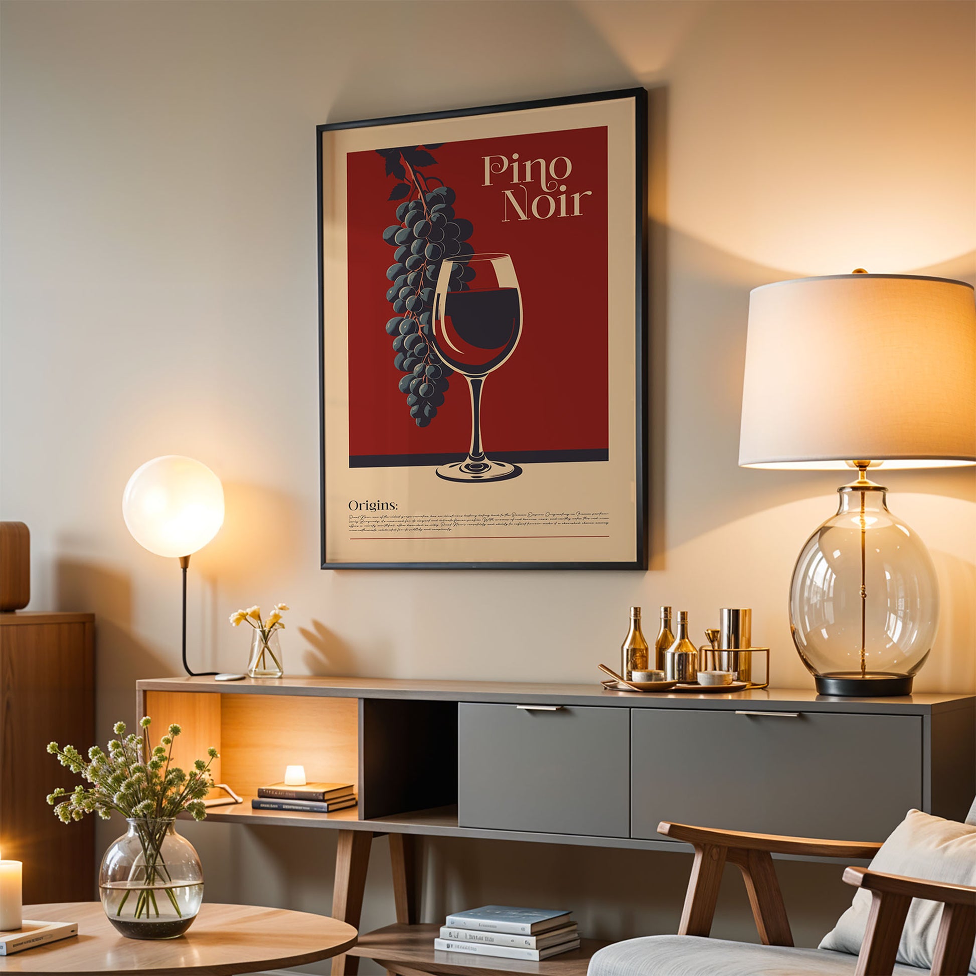 a living room with a framed poster of a wine glass and grapes hanging on the wall, a wooden cabinet with a lamp and decorative items, and a chair in the foreground.
