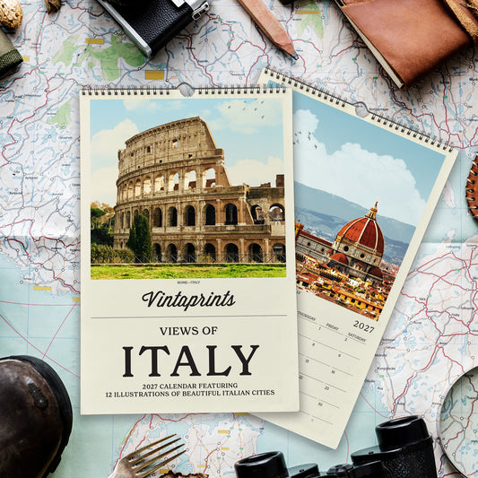 a calendar with a photo of the Colosseum and the Florence Cathedral, surrounded by various travel-related items such as a map, a camera, and a pair of binoculars.