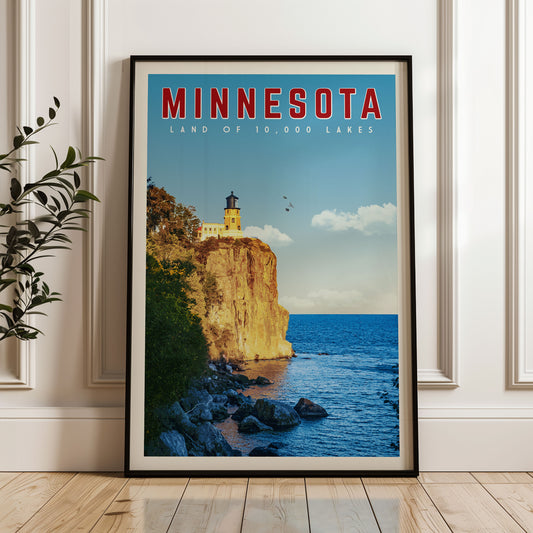 A framed poster of a lighthouse on a cliff overlooking a lake, with the text "MINNESOTA" and "LAND OF 10,000 LAKES" prominently displayed.