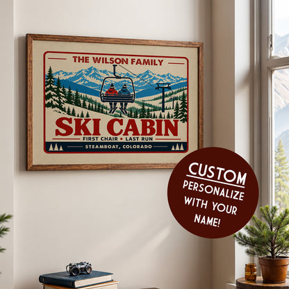a framed poster of a ski cabin with a ski lift, along with a circular sticker that says "CUSTOM PERSONALIZE WITH YOUR NAME!"