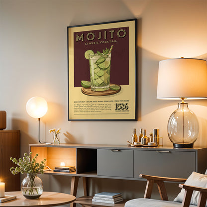 a living room with a framed poster of a mojito cocktail hanging on the wall. The poster has a vintage design and includes a picture of a mojito cocktail with lime slices and a straw. The room also has a lamp, a coffee table, and some decorative items such as a vase with flowers and a stack of books.