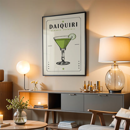 a living room with a framed poster of a classic Daiquiri cocktail hanging on the wall. The poster displays a green cocktail with a lime slice, and the text "DAIQUIRI CLASSIC COCKTAIL" is visible. The room also includes a lamp, a coffee table, and a bookshelf, creating a cozy and stylish atmosphere.