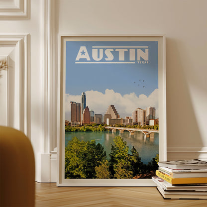 A framed poster of the Austin skyline, with the city's iconic buildings and a river in the foreground.