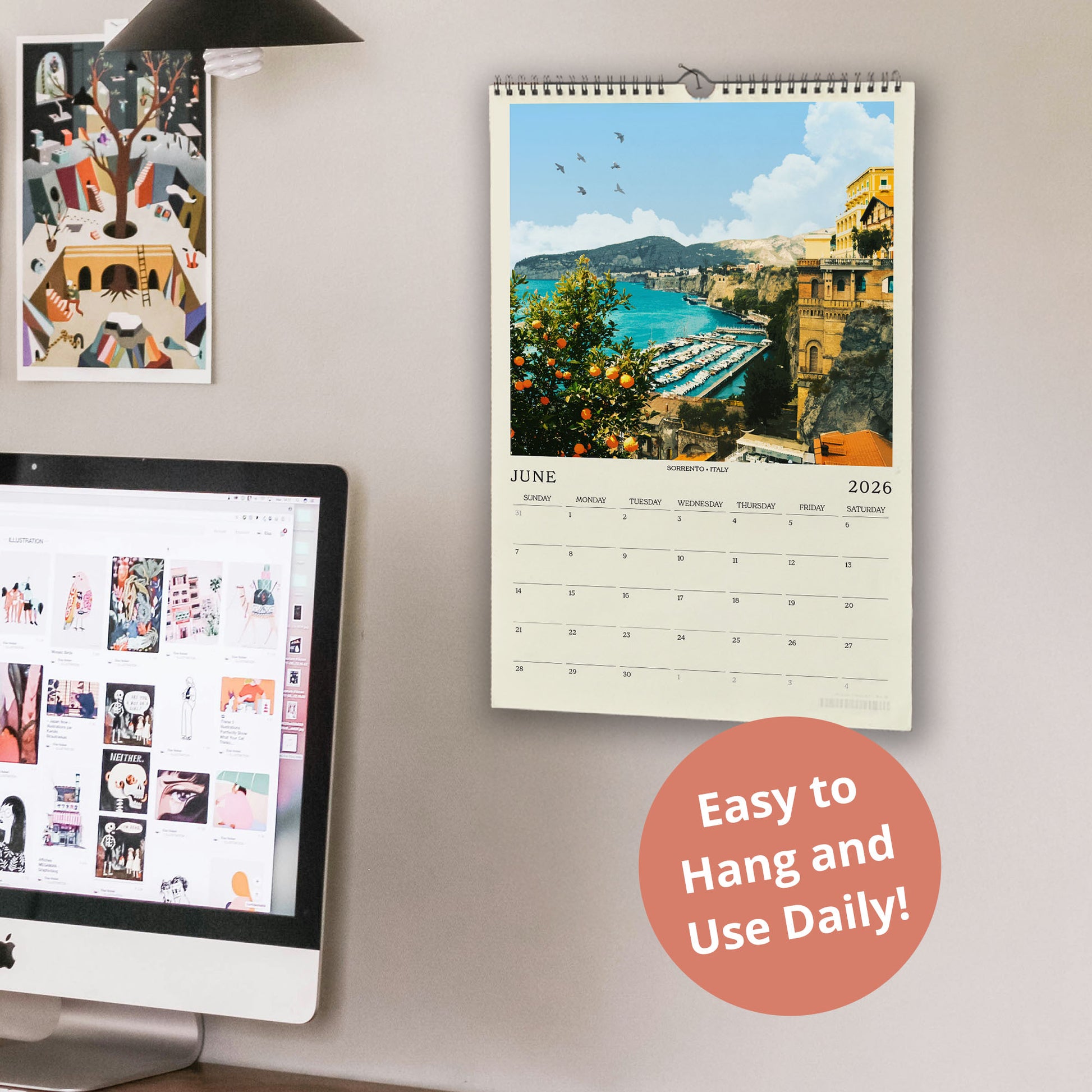 a wall with a calendar and a computer monitor, along with a few other items. The calendar displays a scenic view of a coastal town, and the computer monitor shows a webpage with various images. There is also a text overlay that reads "Easy to Hang and Use Daily!"