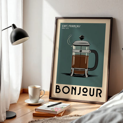 a framed poster of a French press coffee maker, with a cozy and inviting atmosphere surrounding it.