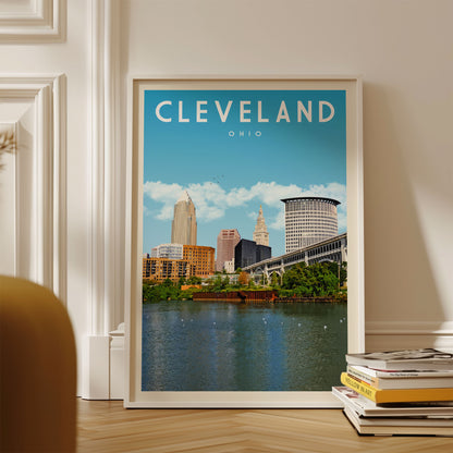 A framed poster of the Cleveland, Ohio skyline, featuring the city's iconic architecture and landmarks, is displayed on a wall.