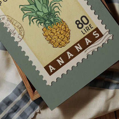 A postage stamp featuring a pineapple illustration, with the text &quot;ANANA&quot; and &quot;80 LIRES&quot; printed on it.