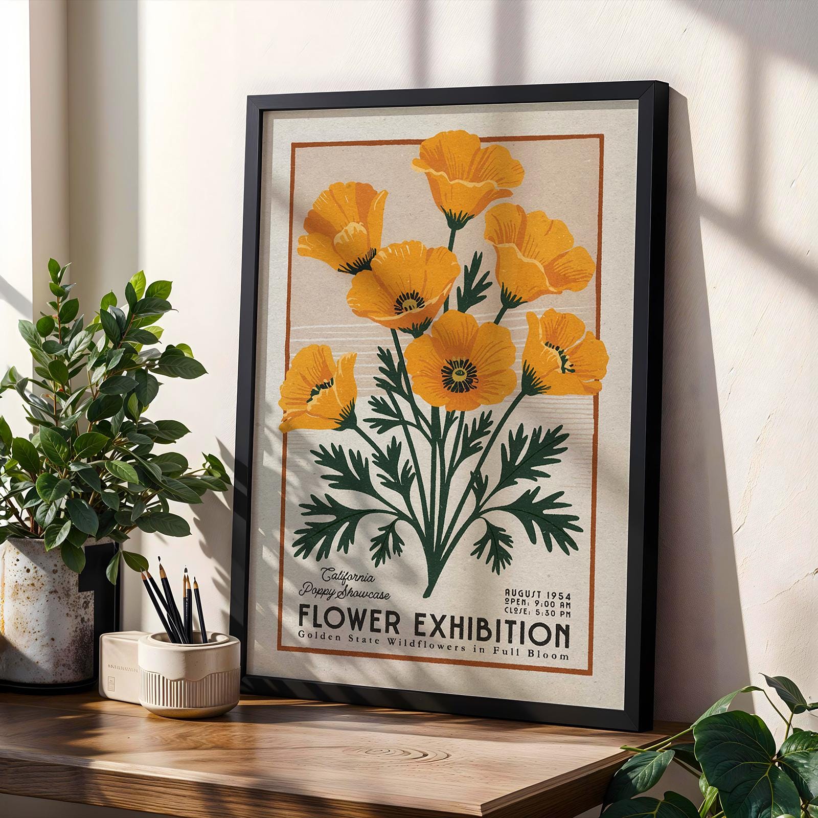 a picture of yellow flowers on a shelf next to a potted plant