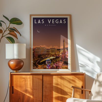 A framed poster of Las Vegas, Nevada, hangs on a wall above a wooden cabinet.