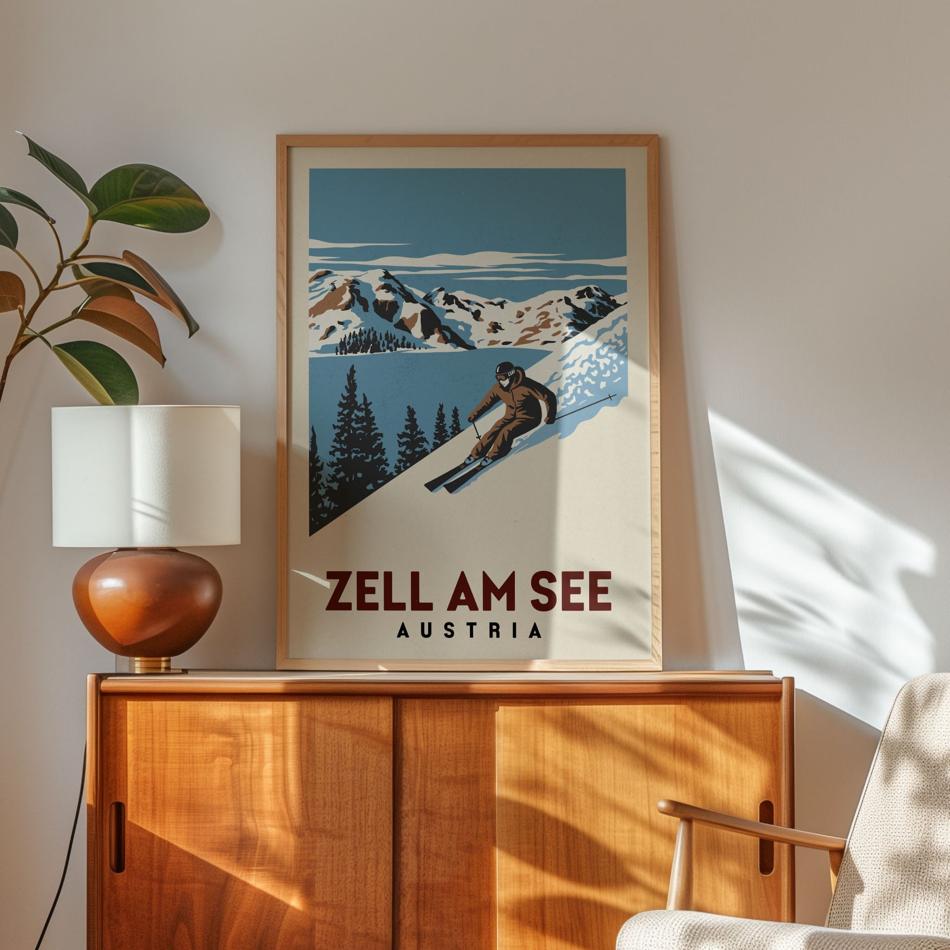 a framed poster of a skier on a snowy mountain, with the text "ZELL AM SEE" and "AUSTRIA" below the illustration.