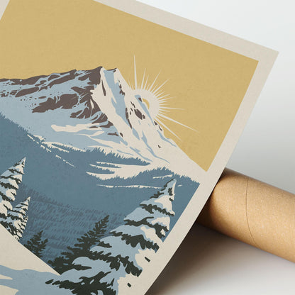 A close-up of a printed image depicting a snowy mountain landscape with pine trees and a sunburst in the background.