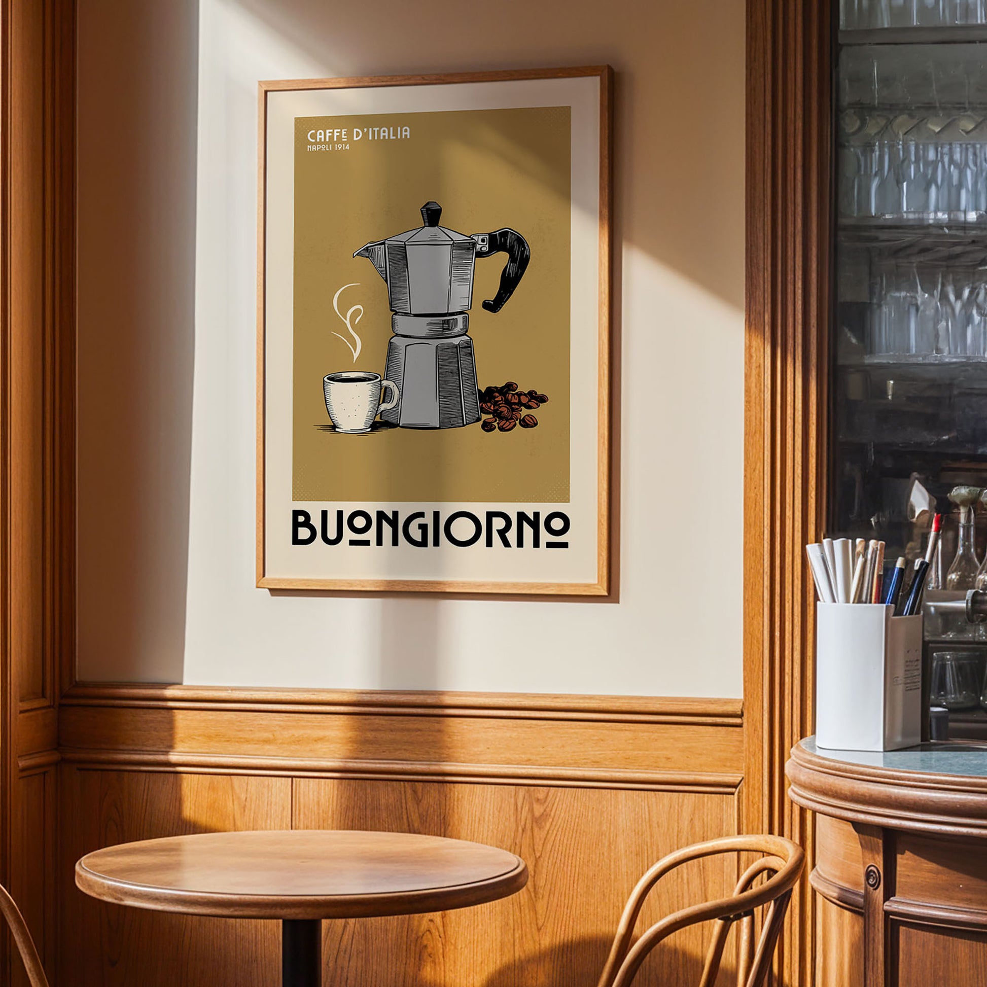 a framed poster of a coffee maker and a cup of coffee on a wall, with the text "Caffe di Italia" and "Buongiorno" below the illustration.