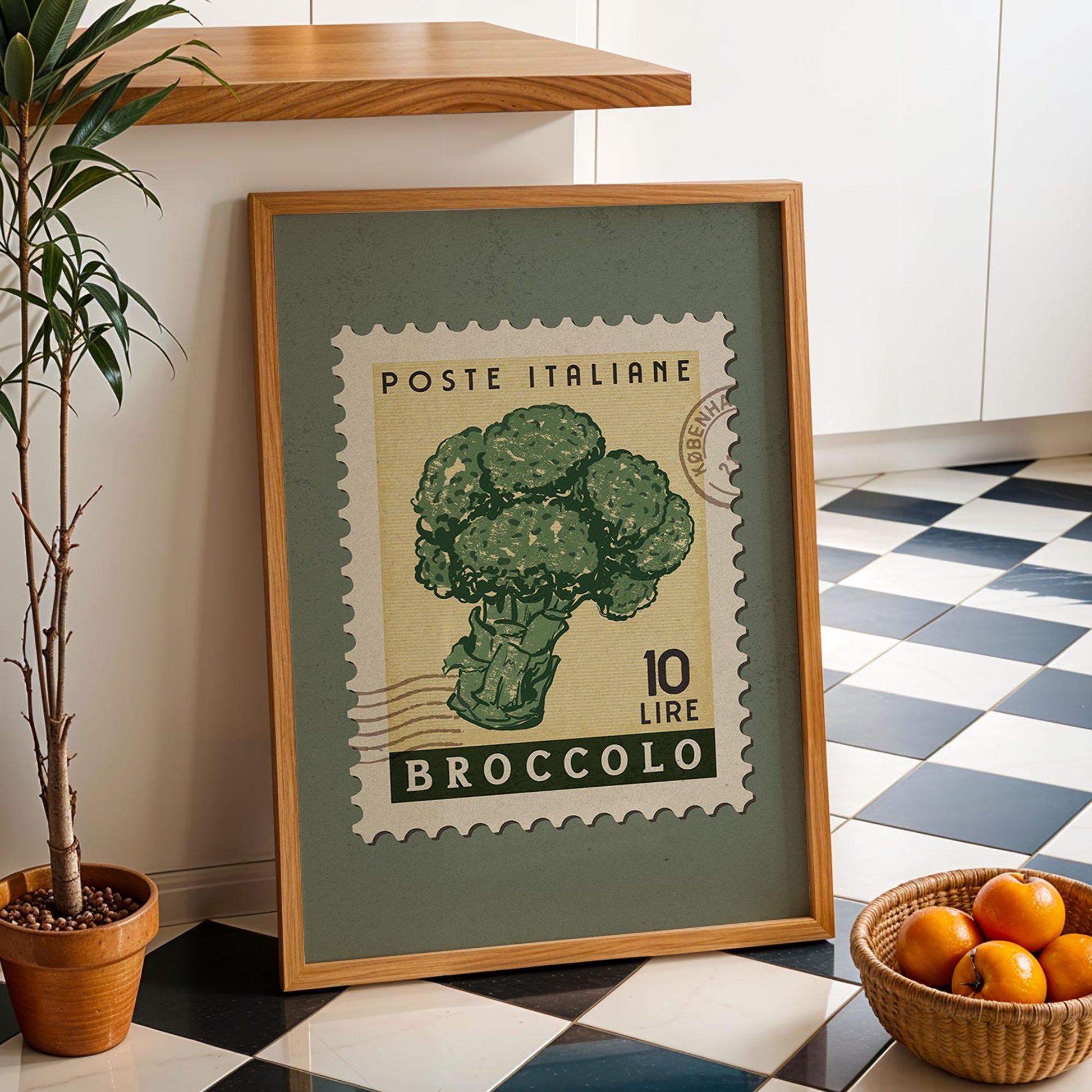 a picture of broccoli on a table next to a basket of oranges