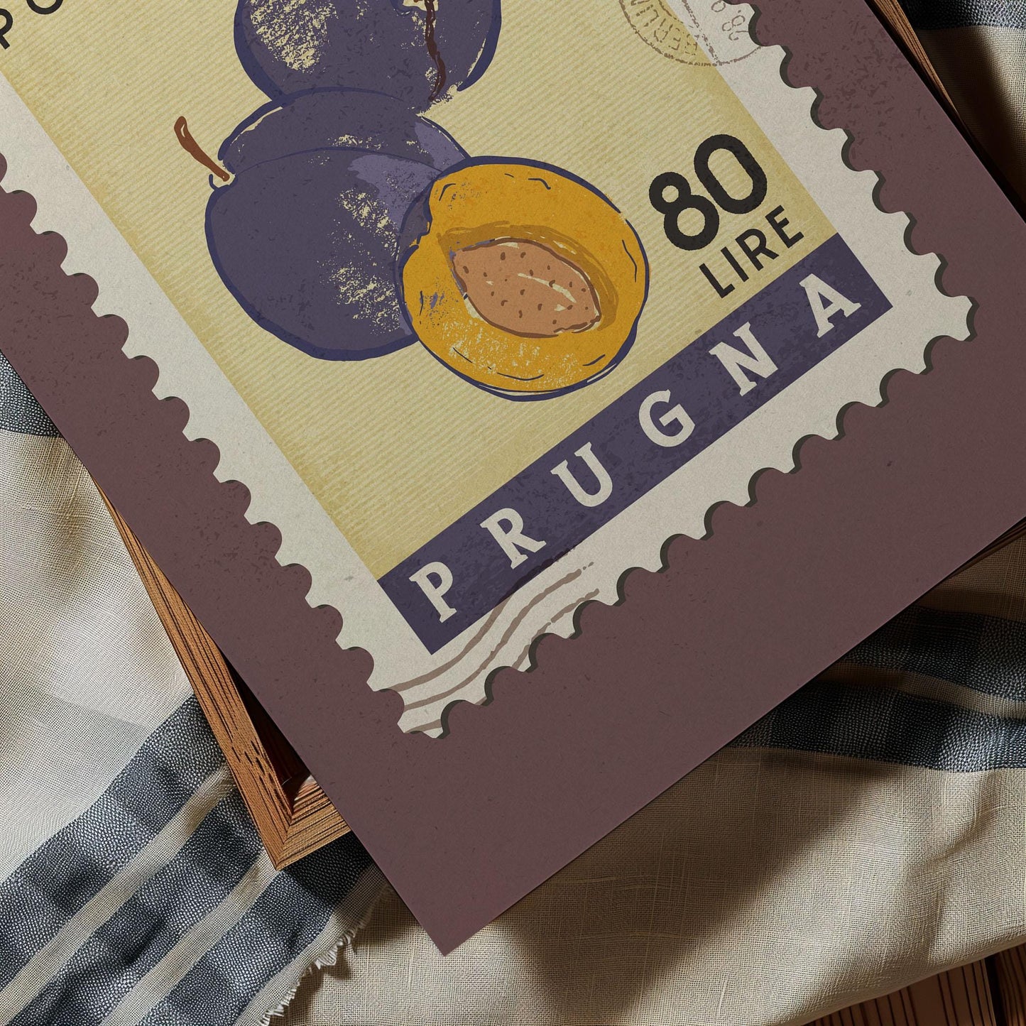 The image is a postage stamp from Prugna, featuring an illustration of plums and a nut.