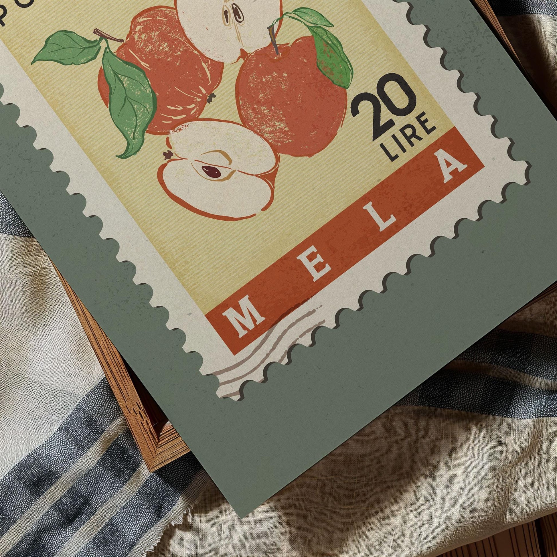 A postage stamp featuring an illustration of apples, with the text &quot;MELA&quot; printed on it.