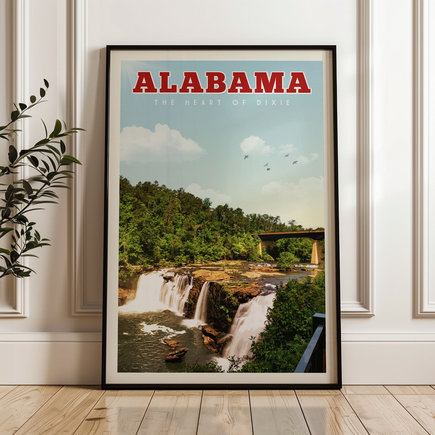 A framed poster of a waterfall in Alabama, with the text "ALABAMA THE HEART OF DIXIE" prominently displayed.
