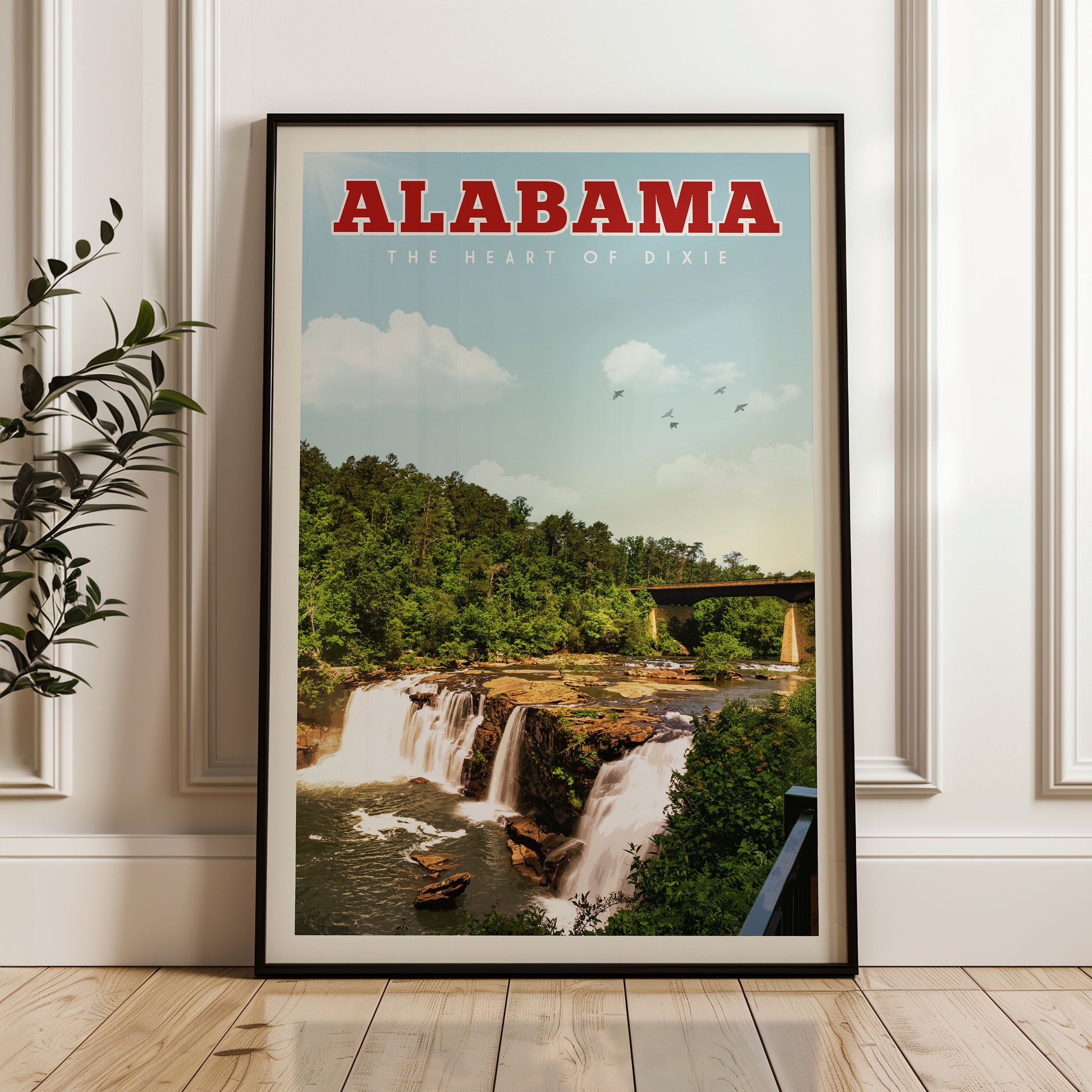 A framed poster of a waterfall in Alabama, with the text "ALABAMA THE HEART OF DIXIE" prominently displayed.