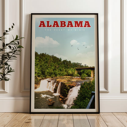 A framed poster of a waterfall in Alabama, with the text "ALABAMA THE HEART OF DIXIE" prominently displayed.