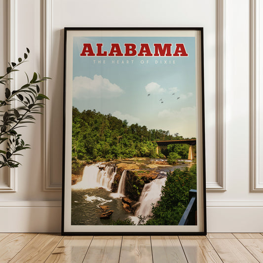 A framed poster of a waterfall in Alabama, with the text "ALABAMA THE HEART OF DIXIE" prominently displayed.