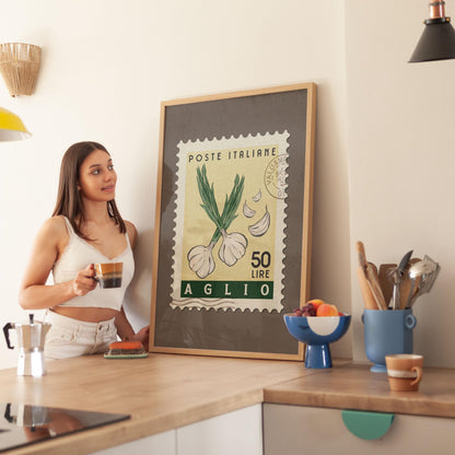 a woman standing in a kitchen next to a framed poster