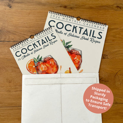 a calendar for cocktails, with a white envelope visible in the foreground.