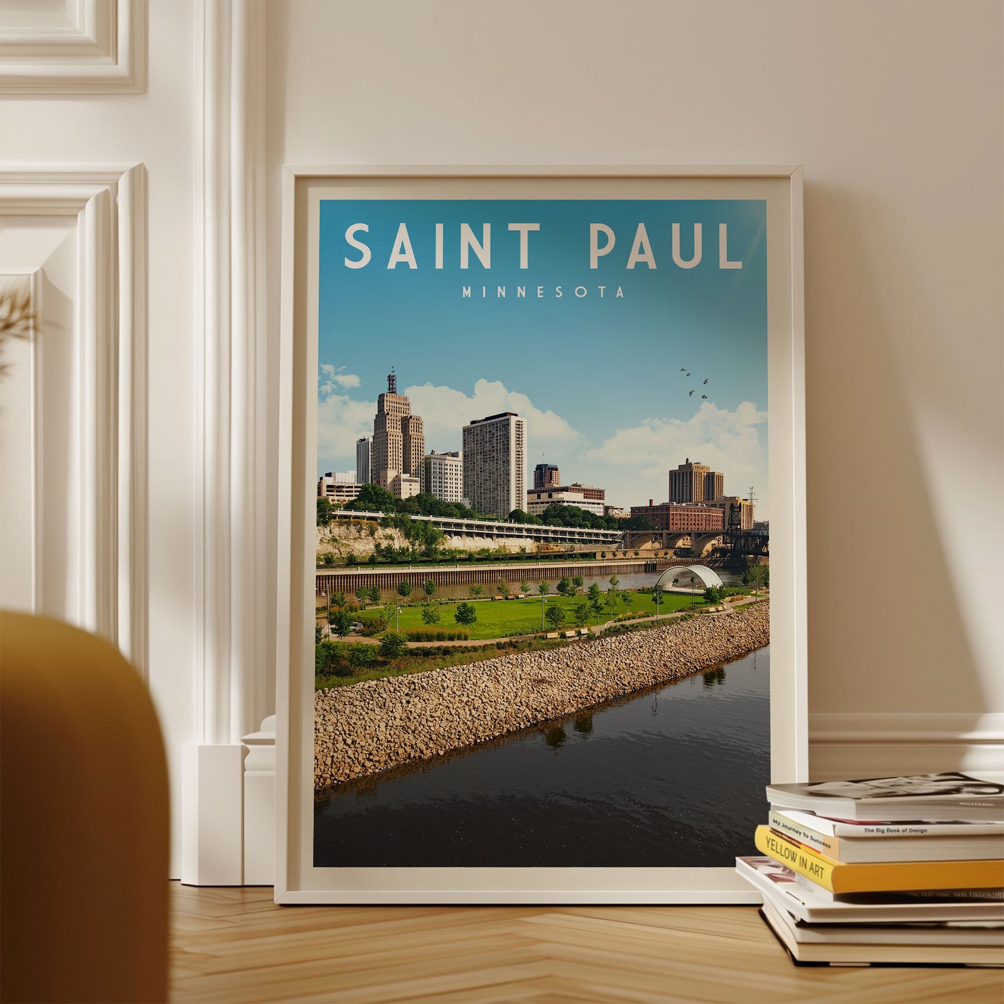 A framed poster of the Saint Paul, Minnesota skyline, with a river and park in the foreground.