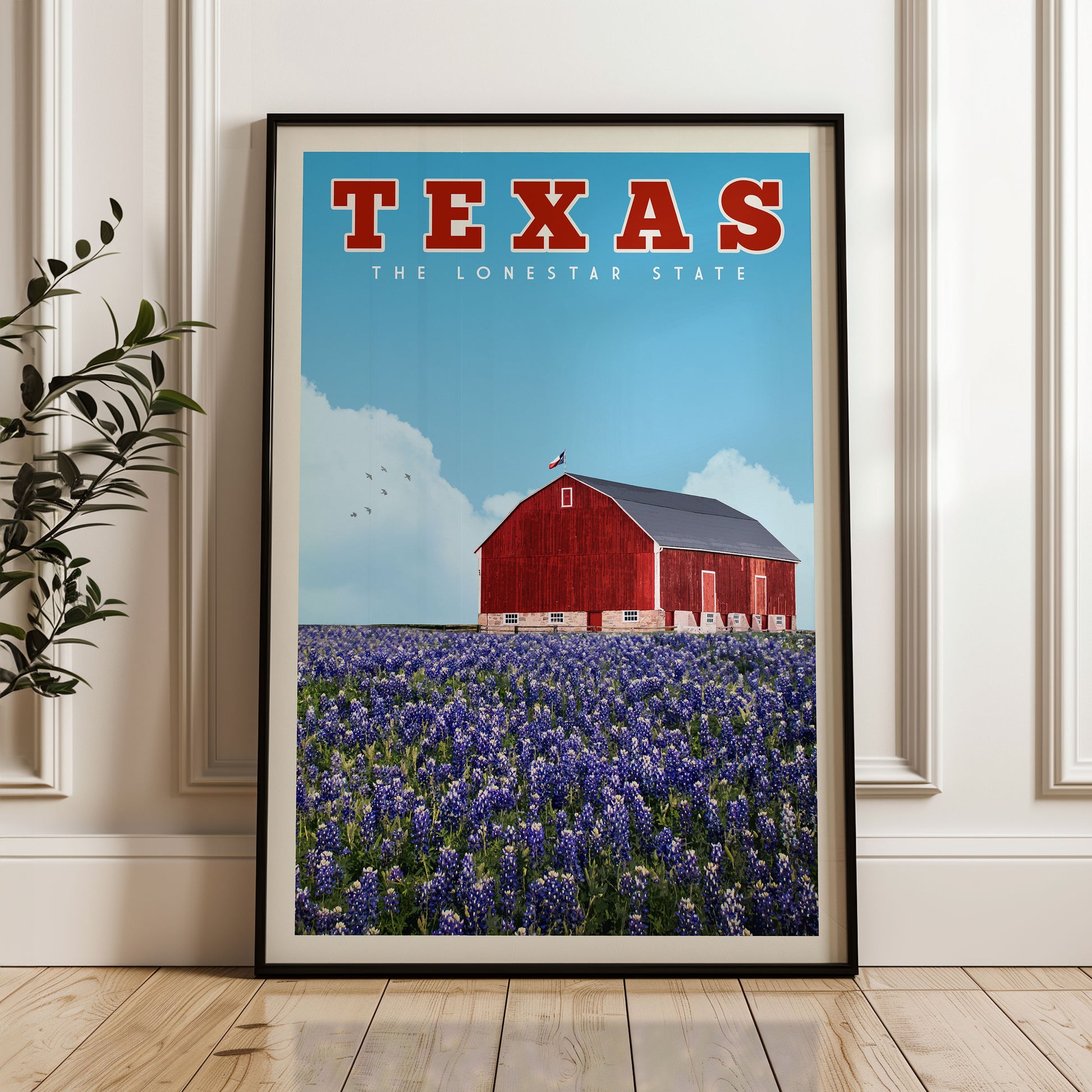 A framed poster of a red barn in a field of purple flowers, with the text "TEXAS THE LONESTAR STATE" prominently displayed.