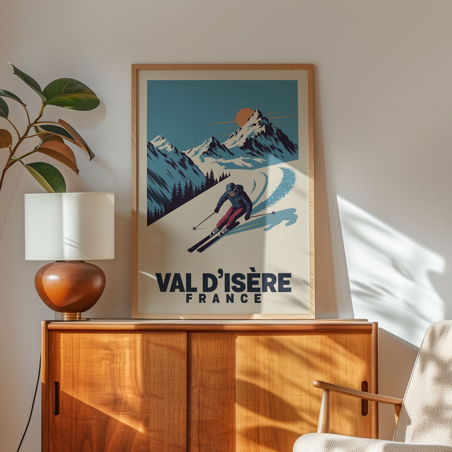 a framed poster of a skier on a mountain slope, with the text "VAL D'ISÉRE FRANCE" below the illustration.
