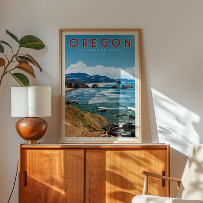 a framed poster of a scenic coastal landscape with mountains and the ocean, hanging on a wall next to a wooden cabinet and a lamp.
