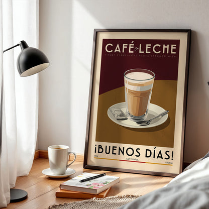 a framed poster of a coffee cup on a table, with a lamp, a book, and a cup of coffee nearby.